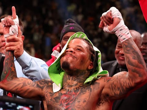 Gervonta Davis in the green and purple trunks reacts after defeating Ryan Garcia in the black trunks by knockout in the seventh round during their catchweight bout at T-Mobile Arena.
