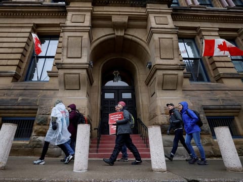 Picketers march around the Office of the Prime Minister and Privy Council as approximately 155,000 public sector union workers with the Public Service Alliance of Canada (PSAC) continue to strike, in Ottawa, Ontario, Canada April 24, 2023.