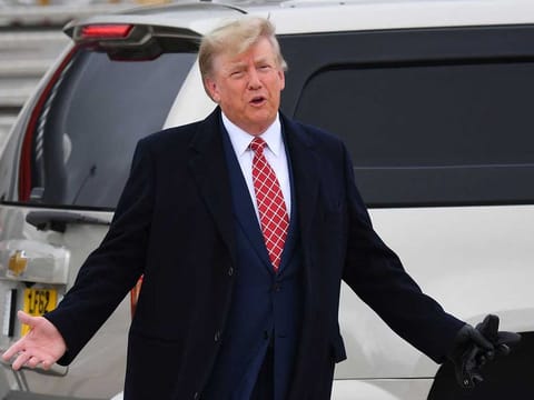 Former US President Donald Trump speaks to members of the media on the tarmac after disembarking "Trump Force One" at Aberdeen airport on the north-east coast of Scotland on May 1, 2023, at the start of his first visit to the country since losing the Presidency.