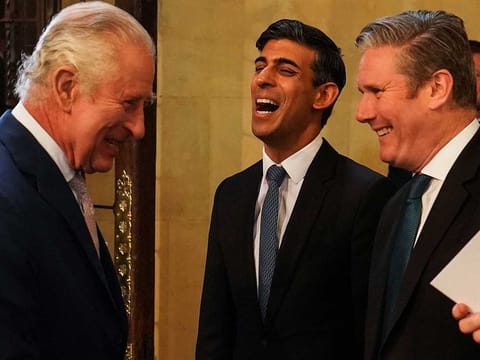 Britain's King Charles III (L) meets with Britain's Prime Minister Rishi Sunak (C) and Britain's opposition Labour Party leader Kier Starmer (R), as he arrives for a visit at Westminster Hall at the Palace of Westminster, in London, on May, 2, 2023, to attend a Reception ahead of his coronation ceremony and his wife, Camilla, as King and Queen of the United Kingdom and Commonwealth Realm nations, on May 6, 2023.