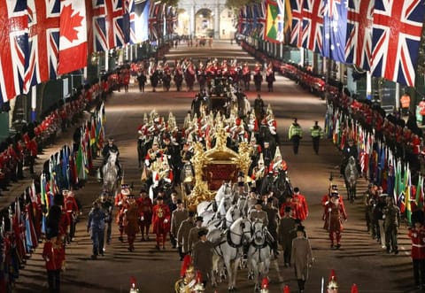 The Gold State Coach is ridden alongside members of the military during a full overnight dress rehearsal of the Coronation Ceremony of Britain’s King Charles and Camilla, Queen Consort in London, Britain, May 3, 2023.