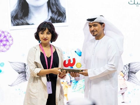 First-place winner Mariana Alcantara Pedraza (left) with Ahmed bin Rakkad Al Ameri, Chairman of Sharjah Book Authority, at the awards ceremony