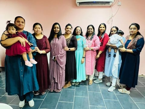 Neethu, one of the Big Ticket weekly draw winners, stand for photograph with her family members and friends
