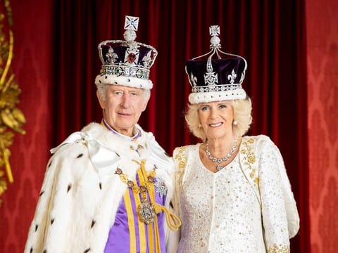 A handout photo taken and released by Buckingham Palace on May 8, 2023 shows Britain's King Charles III and Britain's Queen Camilla posing in the Throne Room at Buckingham Palace, in London. The portrait has been released to mark their Coronation on May 6, 2023.