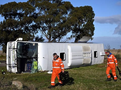 Investigators work at the scene of a bus crash near in Melbourne, Wednesday, May 17, 2023.