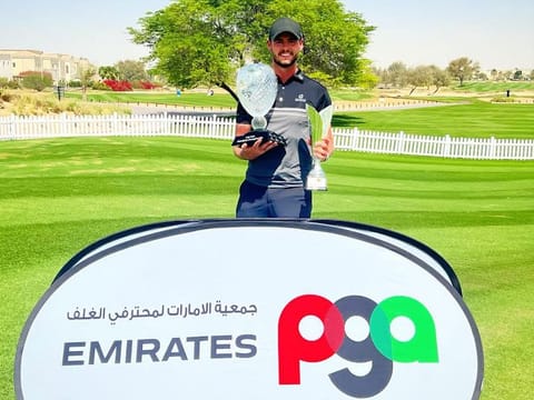 Jackson Bell (TFA, JGE) with the 2022 - 2023 UAE PGA Matchplay and Order of Merit Trophies