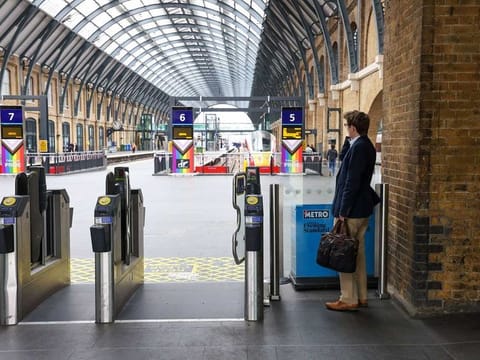Banners and flags featuring the Associated Society of Locomotive Engineers and Firemen (ASLEF) union logo on a picket line during a strike, at London King's Cross railway station in London, UK, on Wednesday, May 31, 2023.