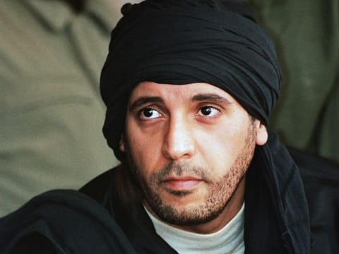 Hannibal Gadhafi, son of ousted Libyan leader Muammar Gaddafi, watches an elite military unit exercise in Zlitan, Libya, on September 25, 2011.