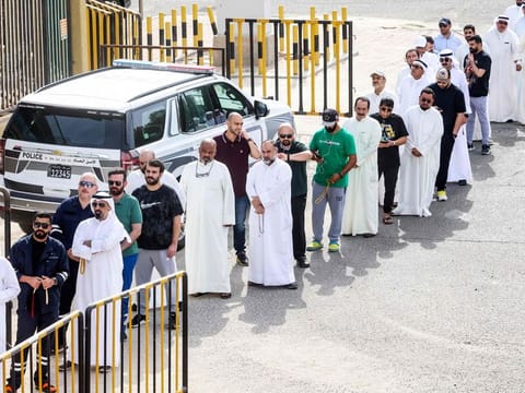 Voters at a polling station during parliamentary elections in Kuwait City on June 6, 2023.