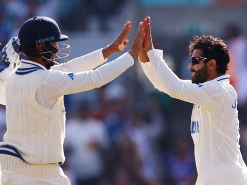 India’s Ravindra Jadeja, right, celebrates with teammates after taking the wicket of Australia’s Travis Head on Day 3 of the ICC World Test Championship cricket final against Australia at The Oval, in London, on June 9, 2023.
