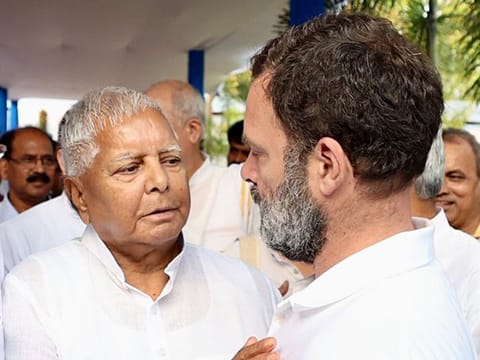 Congress leader Rahul Gandhi interacts with Rashtriya Janata Dal (RJD) chief Lalu Prasad Yadav at the Opposition leaders' meeting, in Patna on Friday.