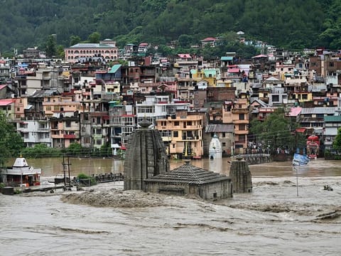 River Beas overflows following heavy rains in Mandi in the northern state of Himachal Pradesh, India, July 10, 2023