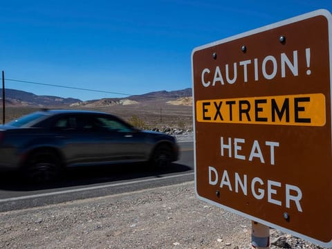 A sign stands warning of extreme heat in Death Valley National Park, Calif. July is the hottest month at the park with an average high of 46.5 Celsius.