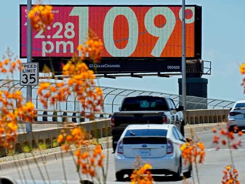 A digital billboard displays an unofficial temperature in downtown Phoenix, Arizona, United States