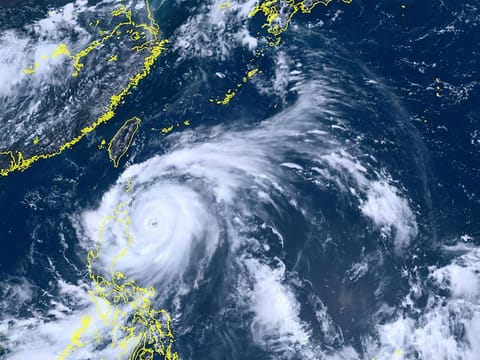 This satellite image taken by Himawari-8, a Japanese weather satellite, shows Typhoon Doksuri near the northern Philippines Tuesday, July 25, 2023.