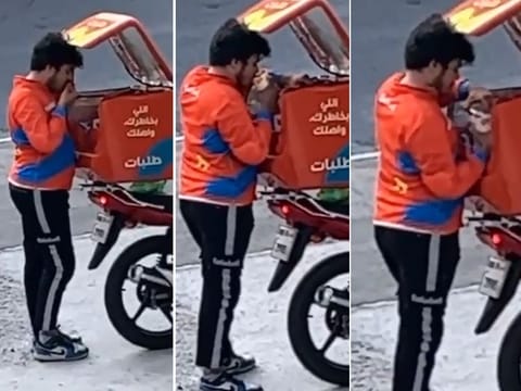 The rider can be seen taking a sip out of two different glasses after eating a few bites.