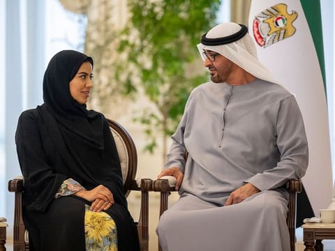 President His Highness Sheikh Mohamed bin Zayed Al Nahyan with Emirati photographer Noura Al Neyadi at Qasr Al Bahar in Abu Dhabi on Wednesday