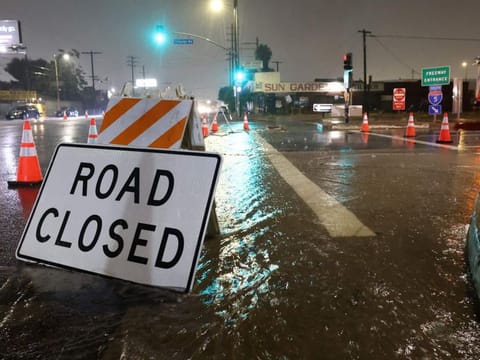 An entrance to southbound Interstate 5 is blocked due to flooding as tropical storm Hilary moves through the area on August 20, 2023 in Sun Valley, California.