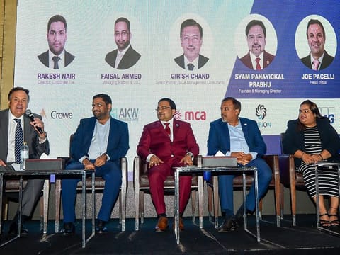 (From left) Joe Pacelli, Rakesh Nair, Syam Panayickal Prabhu, Girish Chand and Manali Chopra during a panel discussion at the Corporate Tax event in Dubai.