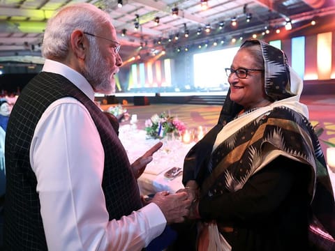 India's Prime Minister Narendra Modi meets Bangladesh Prime Minister Sheikh Hasina at the banquet dinner during the BRICS Summit, in Johannesburg on Wednesday.