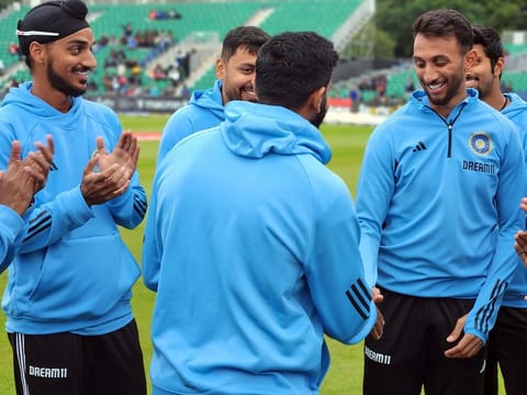 File photo: India's Prasidh Krishna receives his debut T20I cap from captain Jasprit Bumrah ahead of 1st T20I against Ireland, at The Village, in Dublin on August 18, 2023.