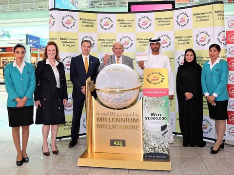 DDF representatives with the million-dollar winning ticket at the draw on Wednesday, held at the airport