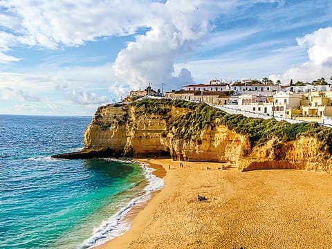 Portugal’s D7 visa lets non-EU expats settle without working or starting a business.