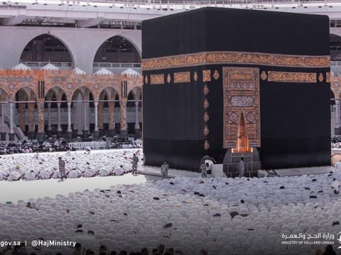 Groups of Umrah pilgrims pray around the Kaaba at the Grand Mosque in Mecca.