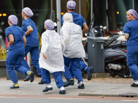 Medical staff leave the Erasmus MC hospital that has been cordoned off following shooting, in Rotterdam, on September 28, 2023.