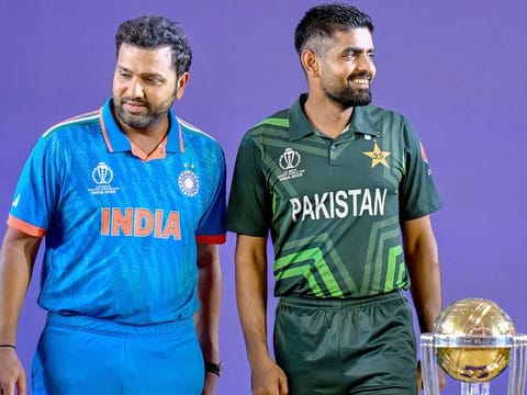 India’s captain Rohit Sharma (left) and his Pakistani counterpart Babar Azam stand beside the tournament trophy as they attend the Captains’ Day event, an interaction session between the captains of all participating teams and the media at the Narendra Modi Stadium in Ahmedabad on October 4, 2023.