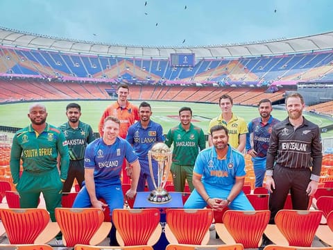 Team captains pose for a picture with the ICC Cricket World Cup trophy at the Narendra Modi Stadium in Ahmedabad on October 4, 2023.