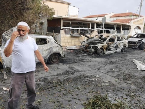 A man inspects the damage in the southern Israeli city of Ashkelon after a rocket attack from Gaza on October 9, 2023.