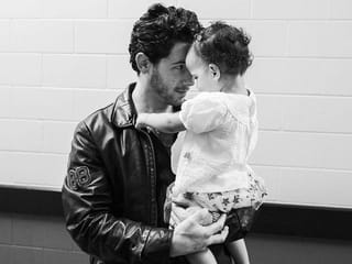 Watch: Singer Nick Jonas shares a dad moment with Malti during performance