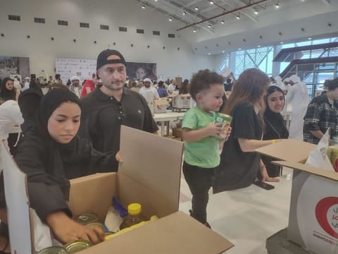 Volunteers at the Tarahum - for Gaza relief campaign in Abu Dhabi on Sunday morning. Salem Abdul Rahman Al Gaabari was among the youngest participants who turned up at the campaign.