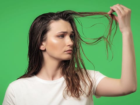 Take a break from daily shampooing by investing in a dedicated sebum-control product.