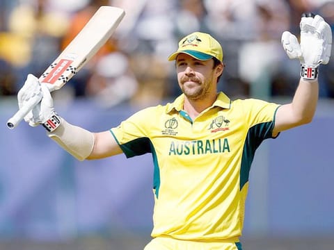 Australia's Travis Head celebrates after scoring a century during the match against New Zealand in the 2023 ICC Men's Cricket World Cup at HPCA Stadium, in Dharamshala on Saturday.