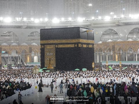 Pilgrims perform Umrah at the Grand Mosque in Mecca during rain on Sunday.