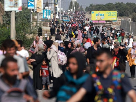Palestinians fleeing Gaza City and other parts of northern Gaza towards the southern areas, walk on a road on November 8, 2023 amid the ongoing battles between Israel and the Palestinian Islamist group Hamas.