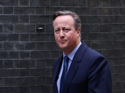Former British Prime Minister David Cameron walks outside 10 Downing Street in London on November 13, 2023.