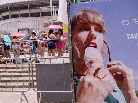 Taylor Swift fans wait for the doors of Nilton Santos Olympic stadium to open for her Eras Tour concert amid a heat wave in Rio de Janeiro, Brazil.