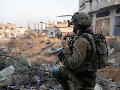 An Israeli soldier takes part in ground operations, amid the ongoing conflict between Israel and Hamas.