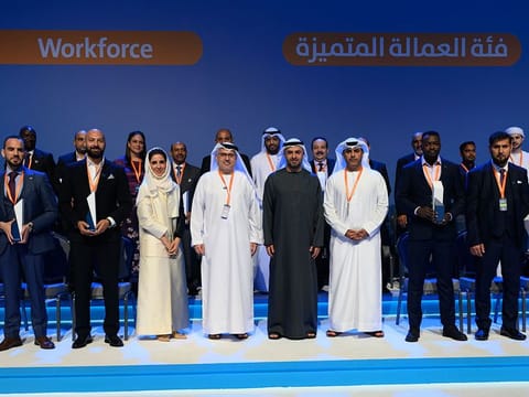Labour Market Awards winners with Sheikh Mohammed bin Hamad bin Tahnoun Al Nahyan, Advisor for Special Affairs at the Ministry of Presidential Court, and Dr Abdulrahman Al Awar, Minister of Human Resources and Emiratisation, at the Abu Dhabi National Exhibition Centre on Thursday