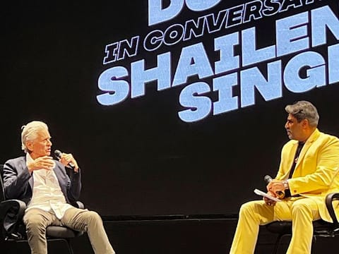Hollywood actor and producer Michael Douglas speaks with Indian film producer Shailendra Singh at a session on the last day of the 54th International Film Festival of India, in Goa, India.