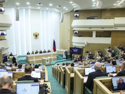 In this photo provided by The Federation Council of The Federal Assembly of The Russian Federation Press Service, lawmakers of Federation Council of the Federal Assembly of the Russian Federation attend a session in Moscow, Russia, on Thursday, Dec. 7, 2023.
