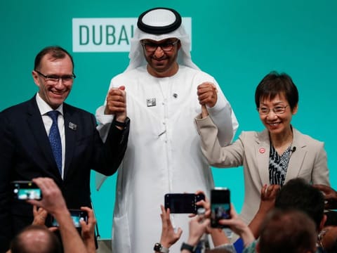 UAE Minister of Industry and Advanced Technology and COP28 President Sultan Ahmed Al Jaber, Norway's Minister of Foreign Affairs Espen Barth Eide and Singapore's Minister for Sustainability and the Environment Grace Fu pose at a press conference at the United Nations Climate Change Conference (COP28) in Dubai on December 8, 2023.