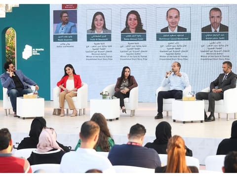 Authors from Morocco and Egypt sharing their thoughts with readers on Friday at the public park in Zayed City, where the book festival is being held