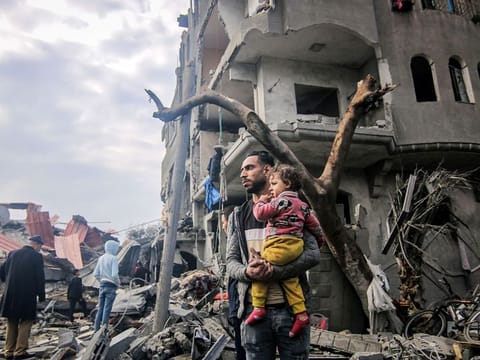 Palestinians inspect the remains of their homes destroyed by Israeli bombardment in Maghazi, central Gaza, on December 25, 2023. More than 20,000 people have been killed in Gaza since the start of the war. “There’s the darkness of parents in Gaza who know that to be a parent there these days means you are passing a death sentence on your children — a place where now the horrors inflicted on both parents and children.”