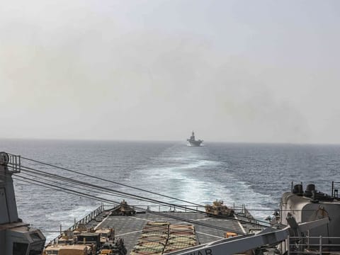 In this image provided by the US Navy, the amphibious dock landing ship USS Carter Hall and amphibious assault ship USS Bataan transit the Bab Al Mandab strait on August 9, 2023. The Alborz warship entered the Red Sea via the Bab Al Mandab Strait, Tasnim said, without saying when. There were unconfirmed reports on social media it arrived late on Saturday.