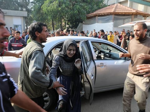 A Palestinian woman wounded in an Israeli strike arrives at the European Hospital, amid the ongoing conflict between Israel and Palestinian Islamist group Hamas, in Khan Younis in the southern Gaza Strip, on January 9, 2024.