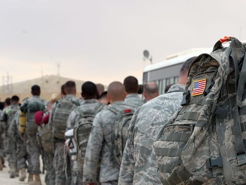 File photo: US army soldiers queue to board a plane to begin their journey home out of Iraq from the Al Asad Air Base west the capital Baghdad.